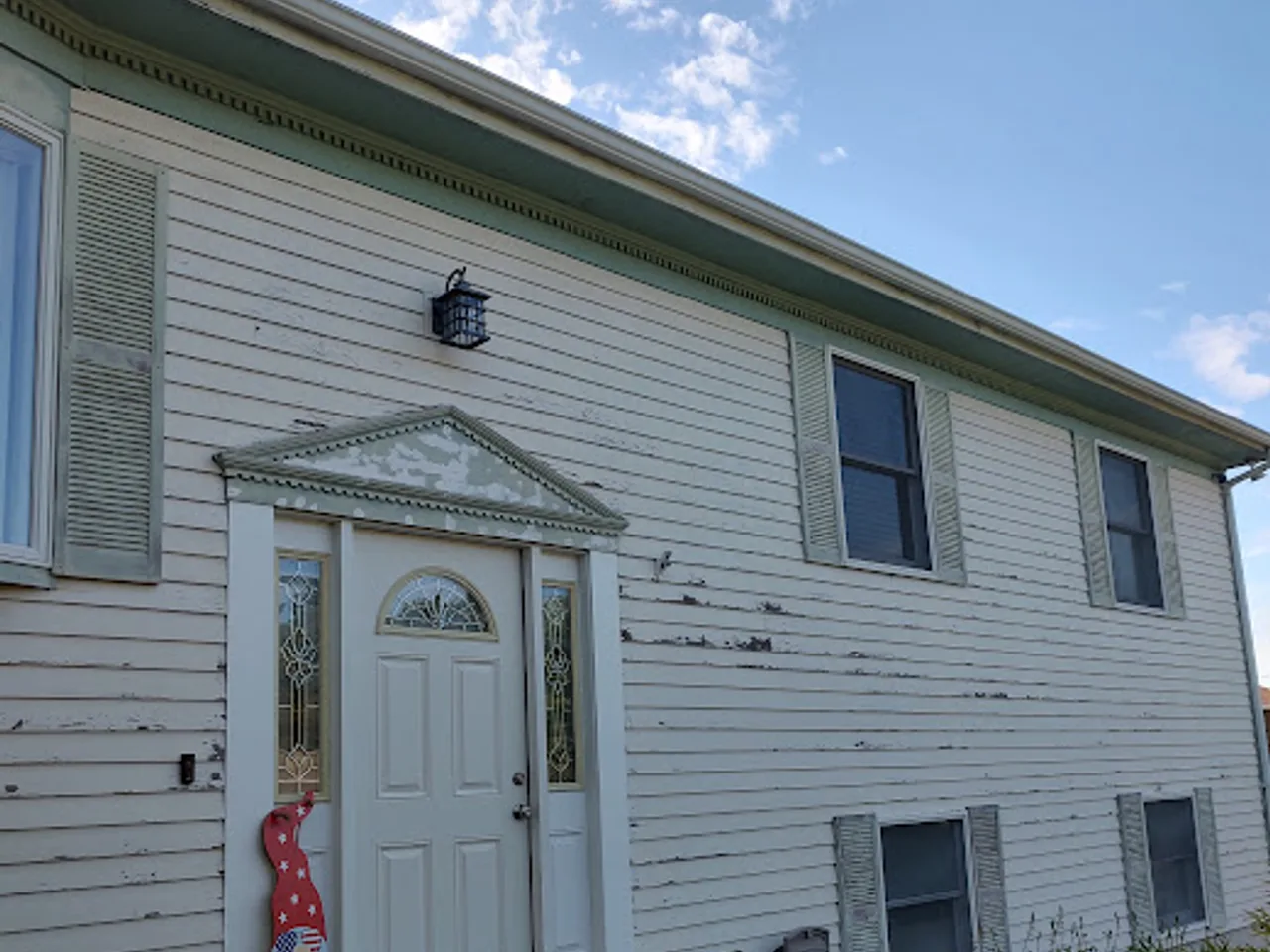 Siding, portico, and stone steps in Bridgewater, MA, before